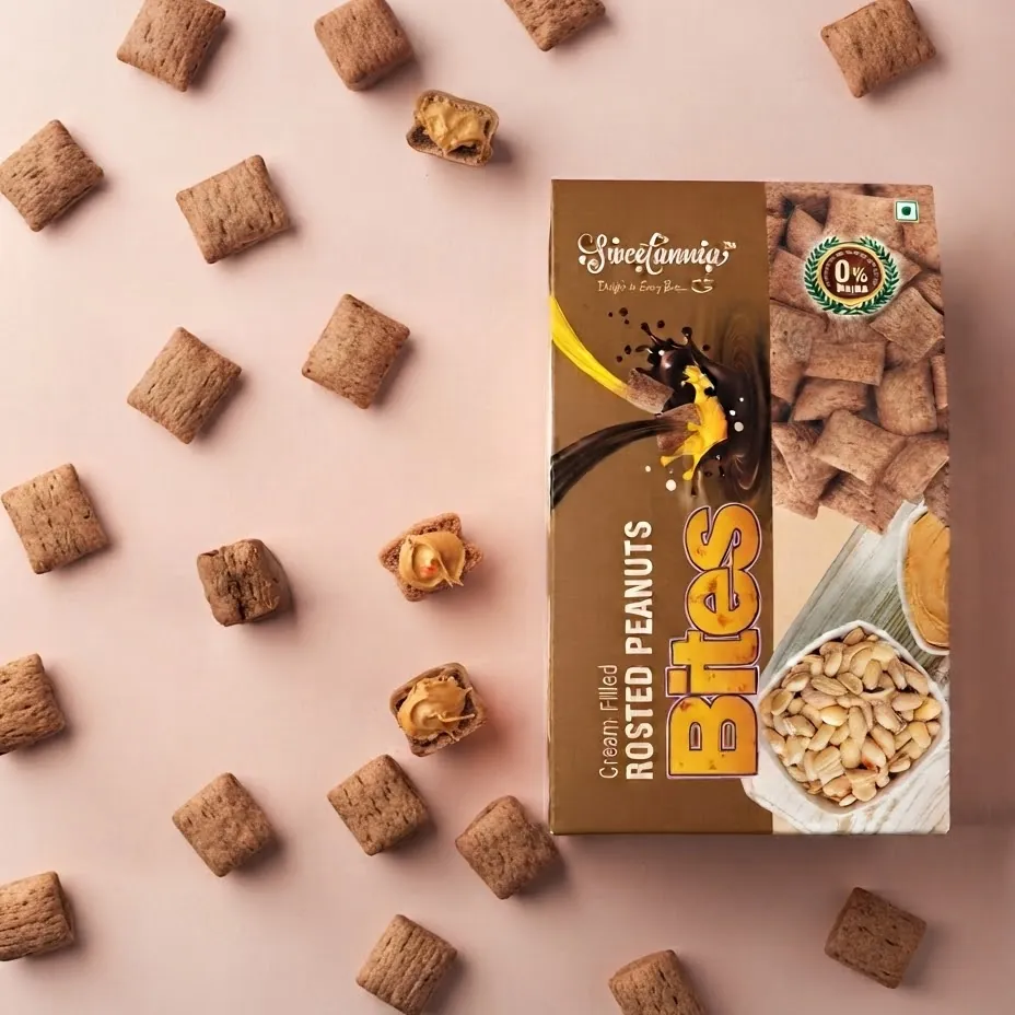Sweetannia Cream Filled Roasted Peanuts Bites box surrounded by peanut-butter-filled bites