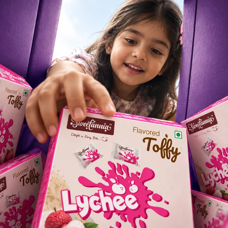 Girl reaching for a box of Sweetannia Lychee flavored toffy
